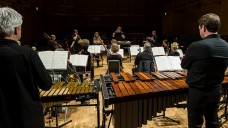 BCMG musicians look on as Thomas Adès conducts 