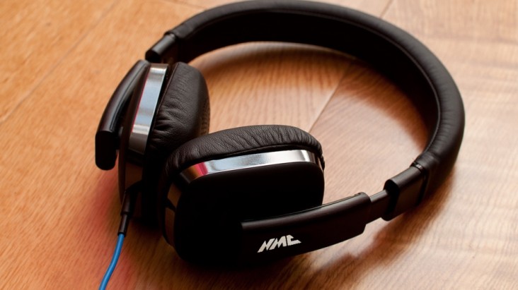 Headphones on table with NMC logo